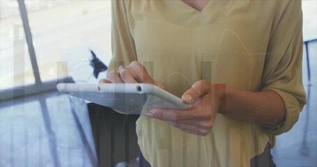 Aufkleber - Using tablet, person interacting with financial data animation over bar graphs