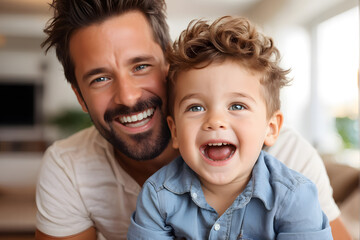 A man and a boy are smiling and posing for a picture