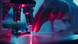 © Tahir AI - Doctora??s hand calibrating laser machine, close-up.