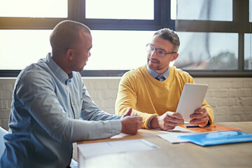 Wall Mural - Meeting, tablet and business men in office for planning, online networking and internet. Creative agency, startup and people on digital tech in discussion for research project, website and report