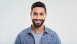 © Marko - A man with a beard and a blue plaid shirt is smiling. He is wearing a gray shirt. Happy man adult face caucasian isolated background handsome confidence