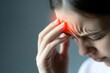 © Janyawatt - Close-up of a person rubbing their temple, depicting persistent headache pain