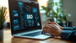 © Bartek - Businessman Analyzing SEO Marketing Strategies on Laptop for Boosting Website Traffic and Internet Visibility in Modern Office Setting