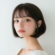 © Surachetsh - Young Asian woman with clean, fresh skin and short hair bobtail style, embodying beauty and cosmetic care concepts.