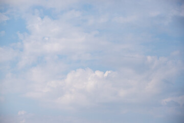 Wall Mural - Sky background with clouds. White clouds against a blue sky.