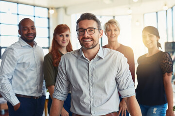 Fototapete - Portrait, leader and business man with team for coworking, cooperation and about us. Face, group diversity and happy manager with employees, staff or compliance officer in startup for collaboration