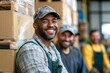 © Alfonso Soler - Group portrait of mixed race men working in warehouse laughing