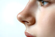 © Oksana - Woman's nose close up side view isolated on white background