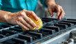 © Pixel Prophet - Close-up hands of people using sponge cleaning stove in the kinchen isolated with white highlights, png