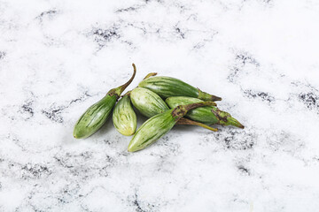 Small organic young green eggplant