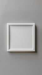 Poster - A blank white frame rests against a soft grey wall, inviting creativity and imagination in a tranquil indoor environment