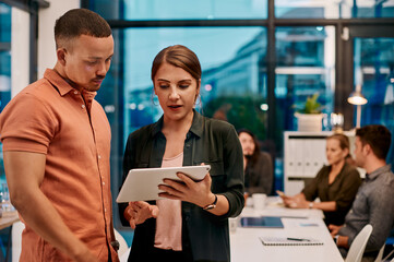 Poster - Business people, tablet and working in office for teamwork, discussion and project deadline with app. Partnership, evening and collaboration in workplace for planning, research or development ideas