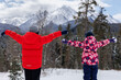 © Studio Peace - A view from the back of the children against the background of snow-capped mountains and forests.