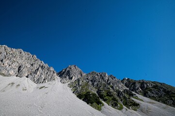 Wall Mural - the landscape of rocky mountains called Nordkette in Tyrol under a clear blue sky