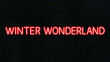 © Erlinda - winter wonderland red neon lettering on plain dark black background