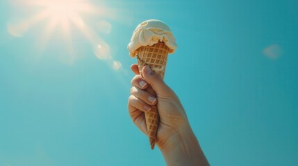 Hand holding a cone tasty ice cream with bright summer sun.