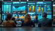 © aekkorn - Group of people seated in a business room with a large screen showing statistics in background.