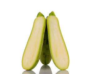 Two halves of ripe zucchini, macro, isolated on white background.