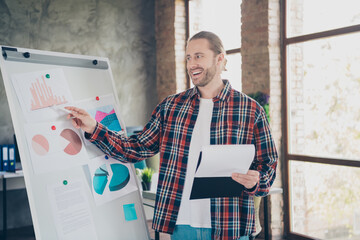 Sticker - Portrait of young office worker man clipboard pen show graphics wear shirt loft interior business center indoors