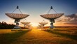 © Enrique - Satellite Dishes in a Field at Sunset