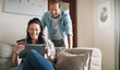 © ReeseBuyout1/peopleimages.com - Laugh, couple and tablet with credit card for online shopping, financial payment and e commerce website. Happy, woman and man with digital for bank information, fintech service and bonding at house