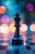 © Marcel - A black chess king piece stands prominently in the foreground, set against an out-of-focus background of colorful lights, symbolizing strategy and leadership.