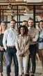 © liliyabatyrova - A diverse team of young professionals poses confidently in a modern office setting, showcasing camaraderie and collaboration during a productive day