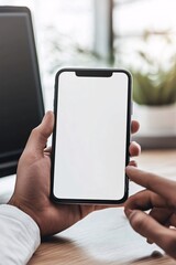 Wall Mural - Businessman holding smartphone with blank screen in office