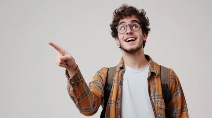 Wall Mural - A young man with glasses and a plaid shirt is giving a thumbs up