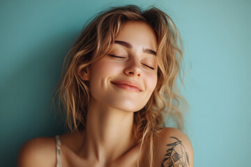 Wall Mural - A close up of a woman's face with tattoos and her eyes closed