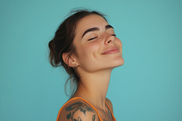 Wall Mural - A close up of a woman's face with tattoos and her eyes closed