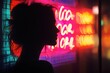 © indyntk - Shadowy outline of a person illuminated by neon signs deep shadows and bright neon hues enhance the mystique