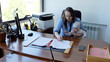 © Alexander - Female in office handles business tasks with baby in arms modern professional and parent multitasking. Professional setting caucasian woman performs work duties holding child parenthood and career.