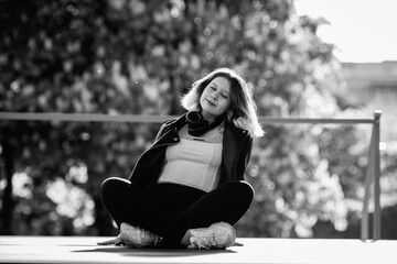 Portrait of a young beautiful short-haired girl in an urban environment.