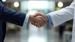 © Leli - A doctor and patient share a firm handshake, symbolizing trust and cooperation