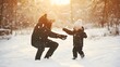 © Felippe Lopes - A father and his young son play in the snow on a sunny winter day.