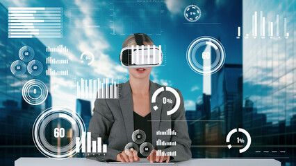 Wall Mural - Woman typing on keyboard selecting dynamic market data analysis monitor by VR global innovation interface digital infographic network technology virtual hologram animation on building bg. Contraption.