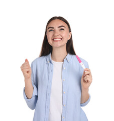 Wall Mural - Happy woman holding pregnancy test on white background