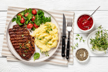 Canvas Print - grilled pork steak with mashed potato and salad