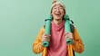 © Salsabila Ariadina - A joyful young man holds yoga mats, ready for a workout in a brightly colored space