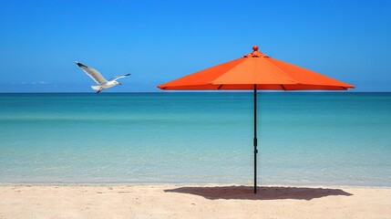 Poster -   An orange umbrella stands out on the beach as a seagull soars above the blue-green waters