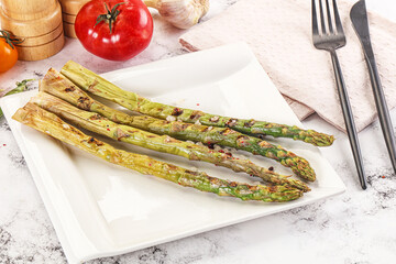 Canvas Print - Grilled asparagus sprouts served red pepper