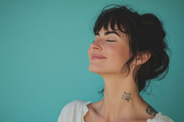 A close up of a woman's face with tattoos and her eyes closed