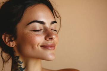 A close up of a woman's face with tattoos and her eyes closed