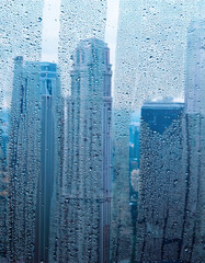 Canvas Print - Water drops on the window city outside