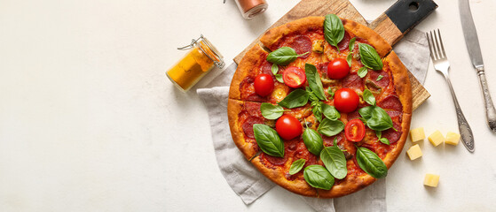 Wall Mural - Wooden board of tasty Pepperoni pizza with tomatoes and basil on white background