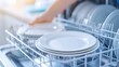 © A2Z AI  - A man takes a white plates out of the dishwasher