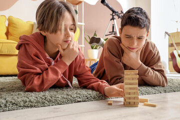 Canvas Print - Happy brothers playing game at home