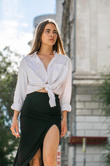 Canvas Print - Portrait of a young beautiful woman in white shirt