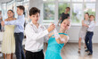 © JackF - Dancing couples - teenagers in festive clothes dance the Viennese waltz in the dance studio